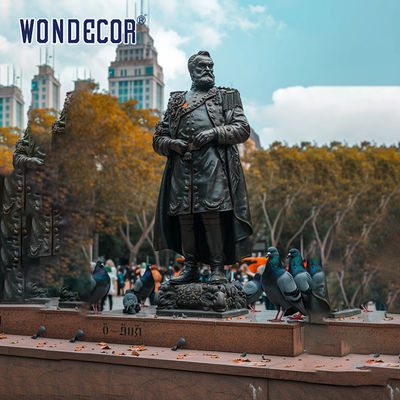 Bronze figure sculpture in urban square garden